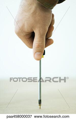 Man using screwdriver, cropped view of hand View Large Photo Image Stock Photo - Man using screwdriver, cropped view of hand. Fotosearch