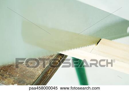 Saw cutting wood, close-up View Large Photo Image Stock Photography - Saw cutting wood, close-up. Fotosearch
