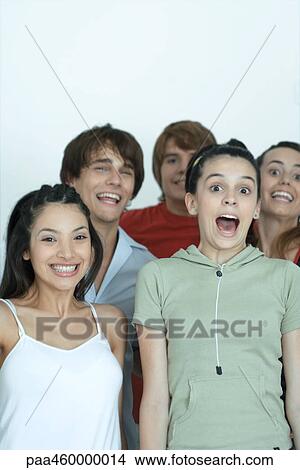 Group of young friends posing for photo, smiling at camera, portrait View Large Photo Image Picture - Group of young friends posing for photo, smiling at camera, portrait. Fotosearch