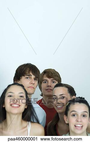 Group of young friends posing for photo, smiling at camera, head and shoulders View Large Photo Image Stock Image - Group of young friends posing for photo, smiling at camera, head and shoulders. Fotosearch