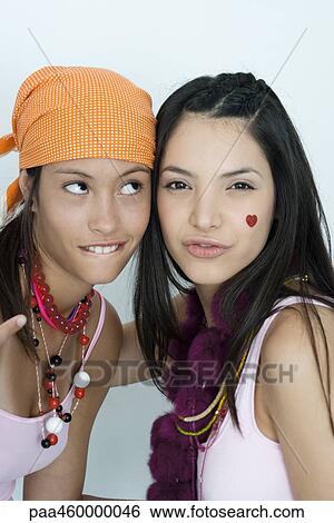 Two young female friends with cheeks together, portrait View Large Photo Image Stock Photograph - Two young female friends with cheeks together, portrait. Fotosearch