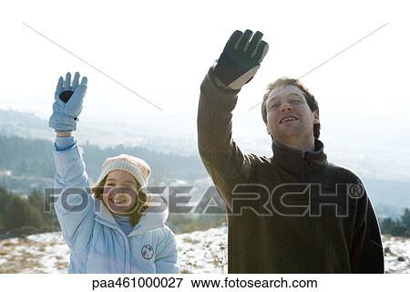 Brother and sister standing side by side, arms raised, smiling View Large Photo Image Stock Photo - Brother and sister standing side by side, arms raised, smiling. Fotosearch