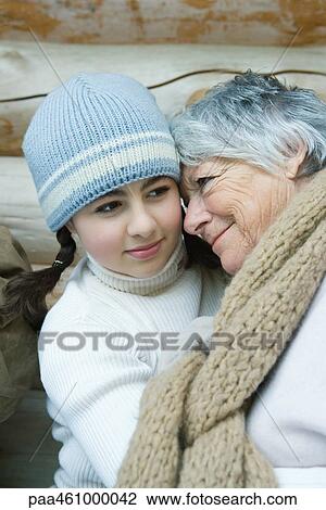 Grandmother and granddaughter, smiling, cheek to cheek, portrait View Large Photo Image Stock Image - Grandmother and granddaughter, smiling, cheek to cheek, portrait. Fotosearch