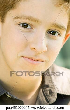 Stock Photography - Boy smiling at camera, portrait. Fotosearch