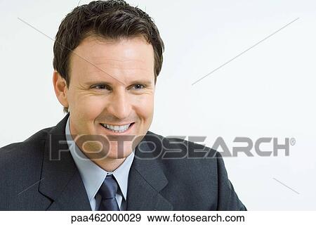 Businessman smiling, looking away, portrait View Large Photo Image Stock Photo - Businessman smiling, looking away, portrait. Fotosearch