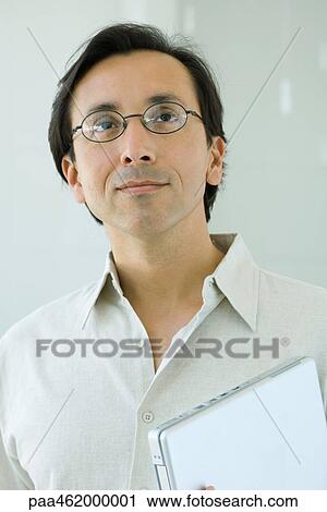 Man looking up, smiling, portrait View Large Photo Image Stock Image - Man looking up, smiling, portrait. Fotosearch
