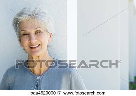 Senior woman smiling at camera, portrait View Large Photo Image Stock Photo - Senior woman smiling at camera, portrait. Fotosearch