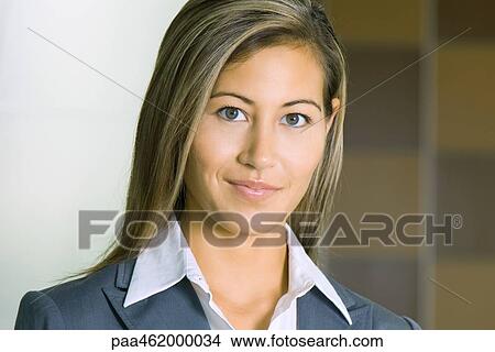 Young businesswoman smiling at camera, portrait View Large Photo Image Picture - Young businesswoman smiling at camera, portrait. Fotosearch