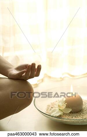 Female sitting in lotus position next to candle, cropped view of hand on bare knee View Large Photo Image Stock Image - Female sitting in lotus position next to candle, cropped view of hand on bare knee. Fotosearch