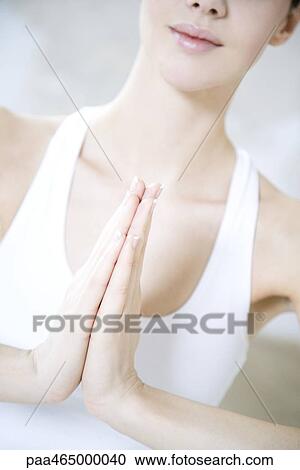 Cropped view of woman in prayer position, close-up View Large Photo Image Stock Image - Cropped view of woman in prayer position, close-up. Fotosearch