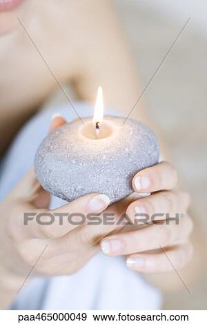 Woman holding burning candle, close-up view of hands View Large Photo Image Stock Photo - Woman holding burning candle, close-up view of hands. Fotosearch
