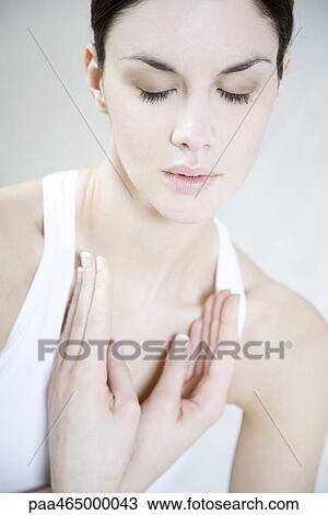 Woman meditating, eyes closed, portrait View Large Photo Image Stock Image - Woman meditating, eyes closed, portrait. Fotosearch
