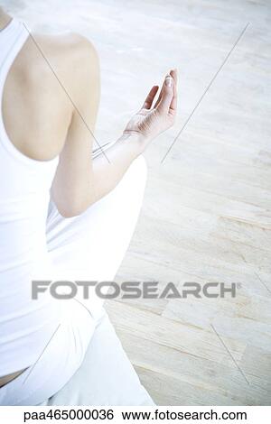 Woman sitting in lotus position, cropped rear view View Large Photo Image Stock Photograph - Woman sitting in lotus position, cropped rear view. Fotosearch