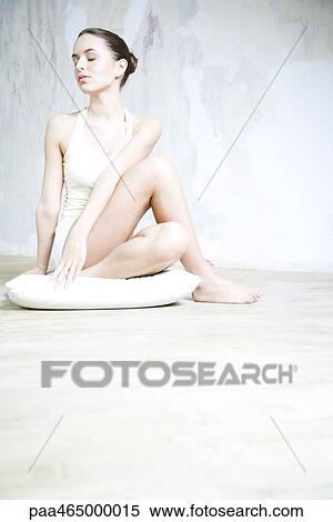 Woman sitting in yoga pose, full length View Large Photo Image Stock Photography - Woman sitting in yoga pose, full length. Fotosearch