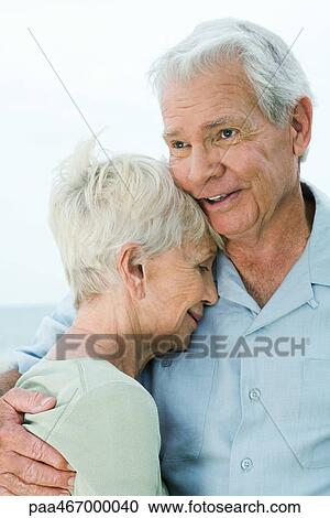 Stock Image - Senior couple hugging. Fotosearch
