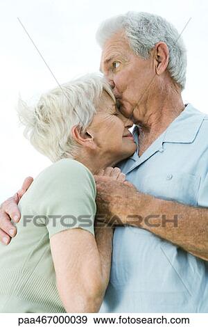 Stock Photo - Senior couple hugging. Fotosearch