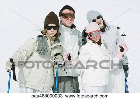 Stock Image - Group of young friends in ski gear, portrait. Fotosearch