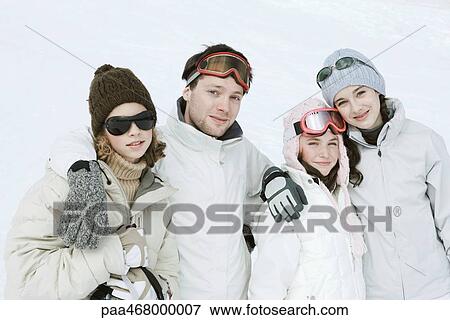 Group of young friends standing in the snow, waist up, portrait View Large Photo Image Stock Photo - Group of young friends standing in the snow, waist up, portrait. Fotosearch