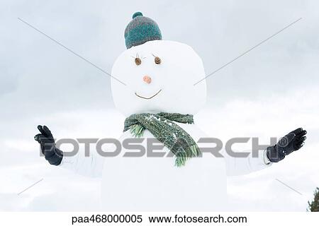 Snowman, person behind sticking out arms View Large Photo Image Stock Photography - Snowman, person behind sticking out arms. Fotosearch