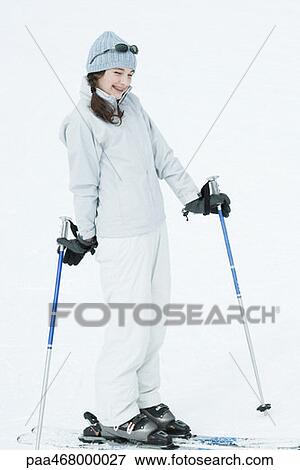Teen girl wearing skis, smiling View Large Photo Image Stock Photo - Teen girl wearing skis, smiling. Fotosearch