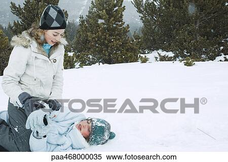 Two teen girls playfighting in snow View Large Photo Image Stock Photography - Two teen girls playfighting in snow. Fotosearch