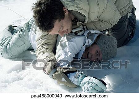 Young friends playfighting in snow View Large Photo Image Stock Photo - Young friends playfighting in snow. Fotosearch