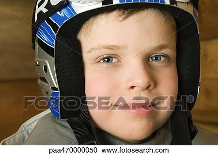 Boy wearing helmet, portrait View Large Photo Image Stock Image - Boy wearing helmet, portrait. Fotosearch