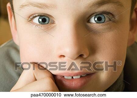Boy's face, looking at camera, close-up View Large Photo Image Stock Image - Boy's face, looking at camera, close-up. Fotosearch