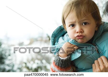 Little boy wearing winter clothes, making face View Large Photo Image Stock Photography - Little boy wearing winter clothes, making face. Fotosearch