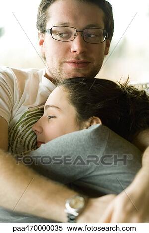 Teen girl hugging young man, close-up View Large Photo Image Stock Photography - Teen girl hugging young man, close-up. Fotosearch