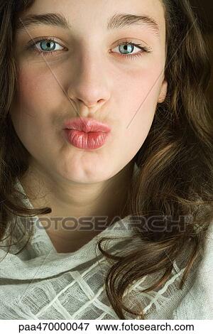 Teen girl with shawl around shoulders, puckering at camera, portrait View Large Photo Image Stock Photo - Teen girl with shawl around shoulders, puckering at camera, portrait. Fotosearch