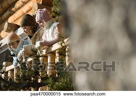 Three preteen or teen girls standing on deck of log cabin, looking away, selective focus View Large Photo Image Stock Photography - Three preteen or teen girls standing on deck of log cabin, looking away, selective focus. Fotosearch