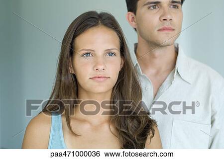 Young friends looking away, close-up View Large Photo Image Stock Photograph - Young friends looking away, close-up. Fotosearch