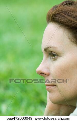 Stock Photo - Woman looking away, profile, close-up. Fotosearch