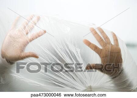 Hands inside plastic bag, cropped view View Large Photo Image Stock Photograph - Hands inside plastic bag, cropped view. Fotosearch