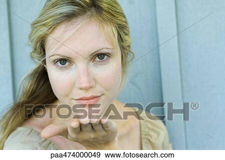 Woman blowing kiss at camera View Large Photo Image Stock Photo - Woman blowing kiss at camera. Fotosearch