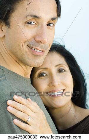 Married couple smiling at camera together, portrait View Large Photo Image Stock Image - Married couple smiling at camera together, portrait. Fotosearch
