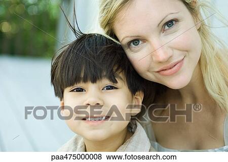Mother and son smiling at camera, portrait View Large Photo Image Stock Photo - Mother and son smiling at camera, portrait. Fotosearch