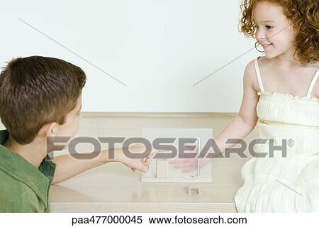 Brother and sister playing together View Large Photo Image Stock Photography - Brother and sister playing together. Fotosearch