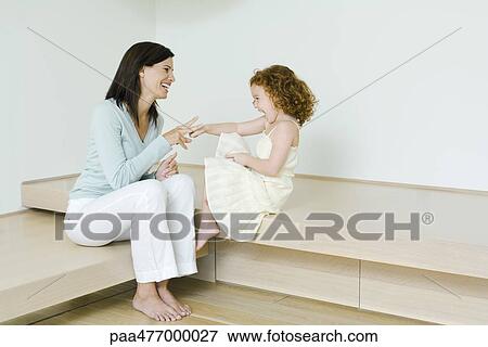 Mother and little girl playing rock paper scissors, laughing, full length View Large Photo Image Stock Photo - Mother and little girl playing rock paper scissors, laughing, full length. Fotosearch