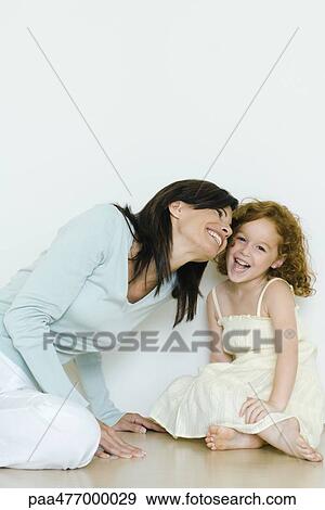 Stock Photo - Mother and little girl smiling. Fotosearch