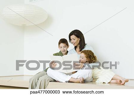 Mother reading book to boy and girl View Large Photo Image Stock Image - Mother reading book to boy and girl. Fotosearch