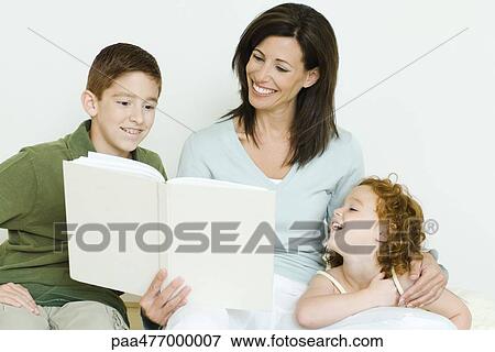 Mother reading book to son and daughter View Large Photo Image Stock Photo - Mother reading book to son and daughter. Fotosearch