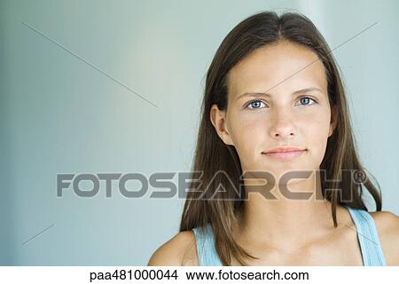 Teenage girl smiling at camera, portrait View Large Photo Image Picture - Teenage girl smiling at camera, portrait. Fotosearch