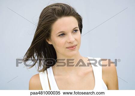 Teenage girl smiling, looking away, portrait View Large Photo Image Stock Photography - Teenage girl smiling, looking away, portrait. Fotosearch