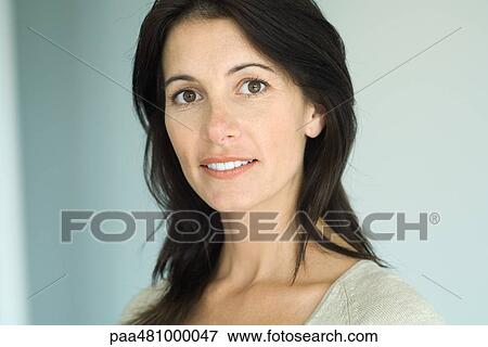 Woman smiling at camera, portrait View Large Photo Image Stock Photo - Woman smiling at camera, portrait. Fotosearch