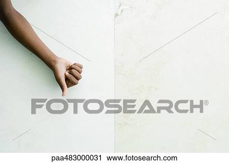 Hand making thumbs down gesture, cropped view View Large Photo Image Stock Image - Hand making thumbs down gesture, cropped view. Fotosearch