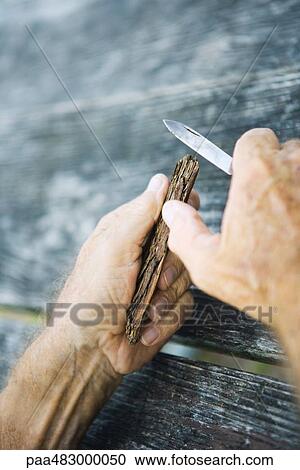 Man carving wood with knife, cropped view of hands View Large Photo Image Stock Image - Man carving wood with knife, cropped view of hands. Fotosearch