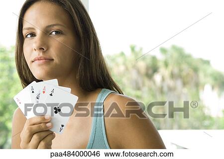 Teenage girl showing cards, smiling at camera View Large Photo Image Stock Photograph - Teenage girl showing cards, smiling at camera. Fotosearch