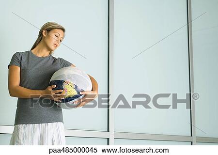 Woman holding bandaged globe View Large Photo Image Stock Photography - Woman holding bandaged globe. Fotosearch